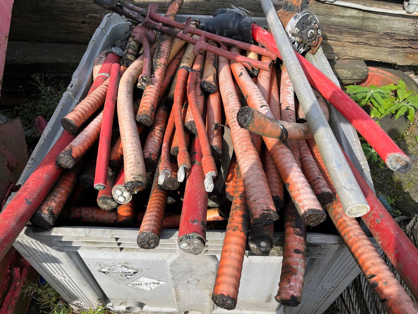 Bundles of copper-cored cable offcuts in a stillage