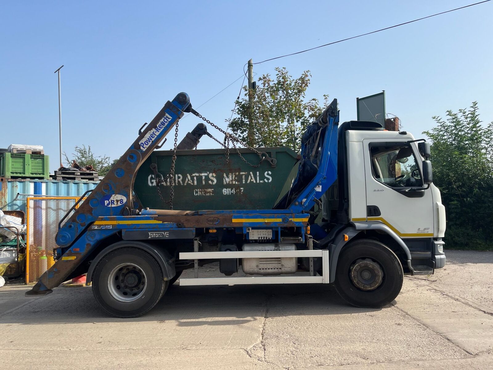 Garratt's Metals skip lorry loaded with a skip