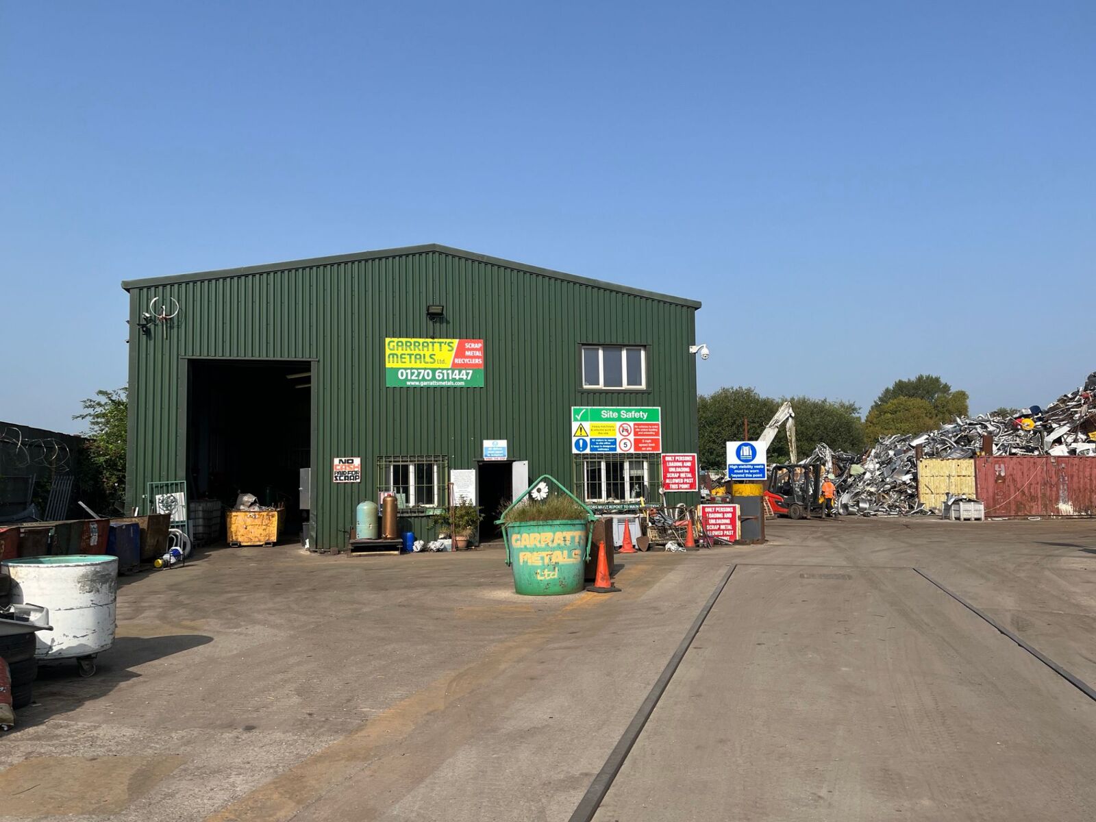 Workshop entrance and yard vehicles